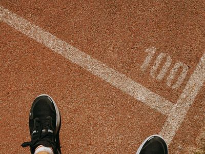 Close up of sports shoes on a running track.