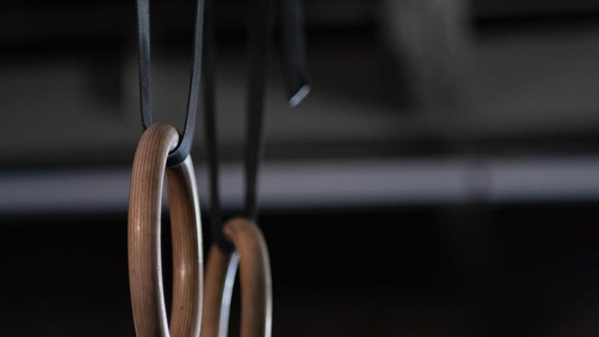 Professional gym equipment in a minimalist dark studio setting.